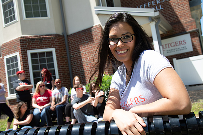 Student sitting on outdoor bench