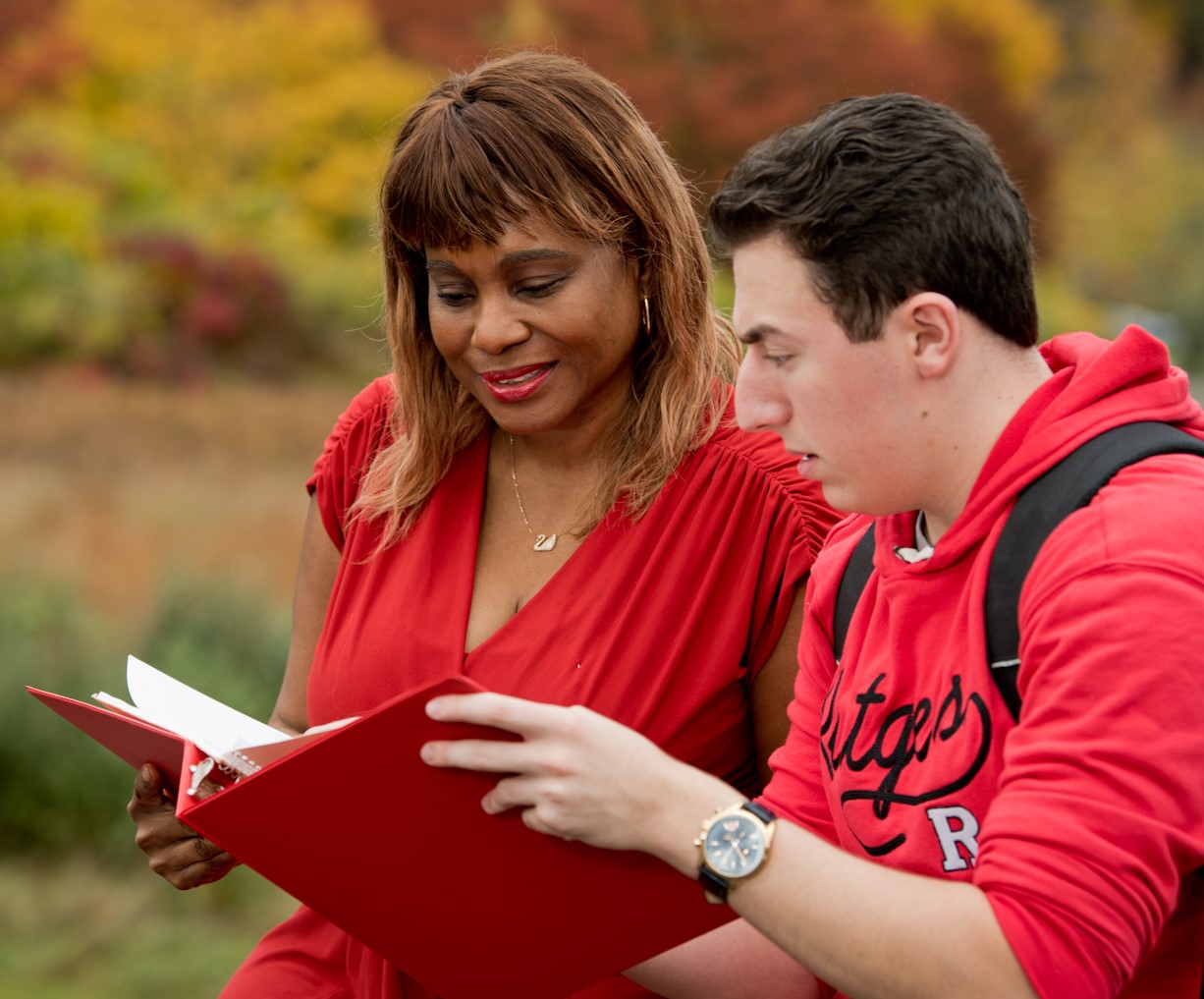 Students reading a book together