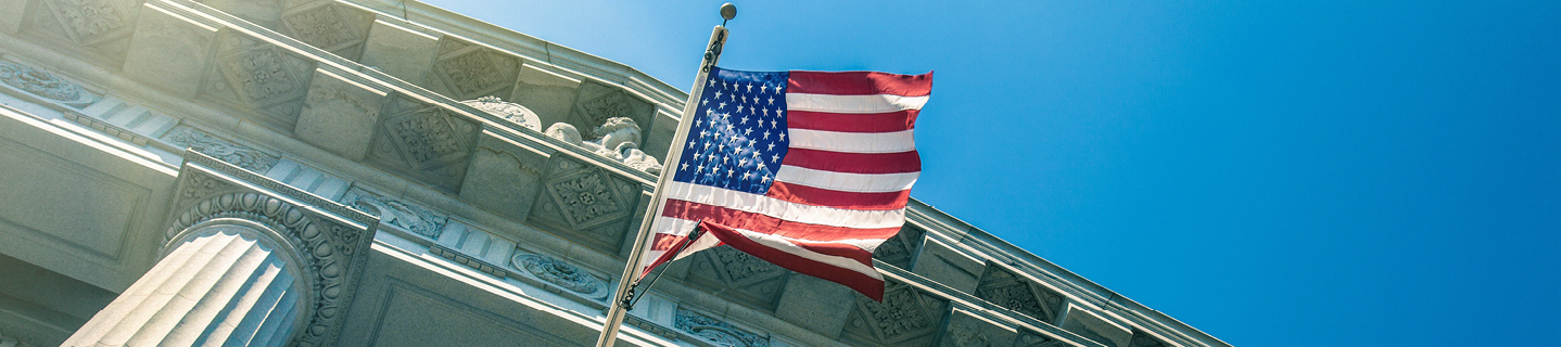 American flag hanging on government building