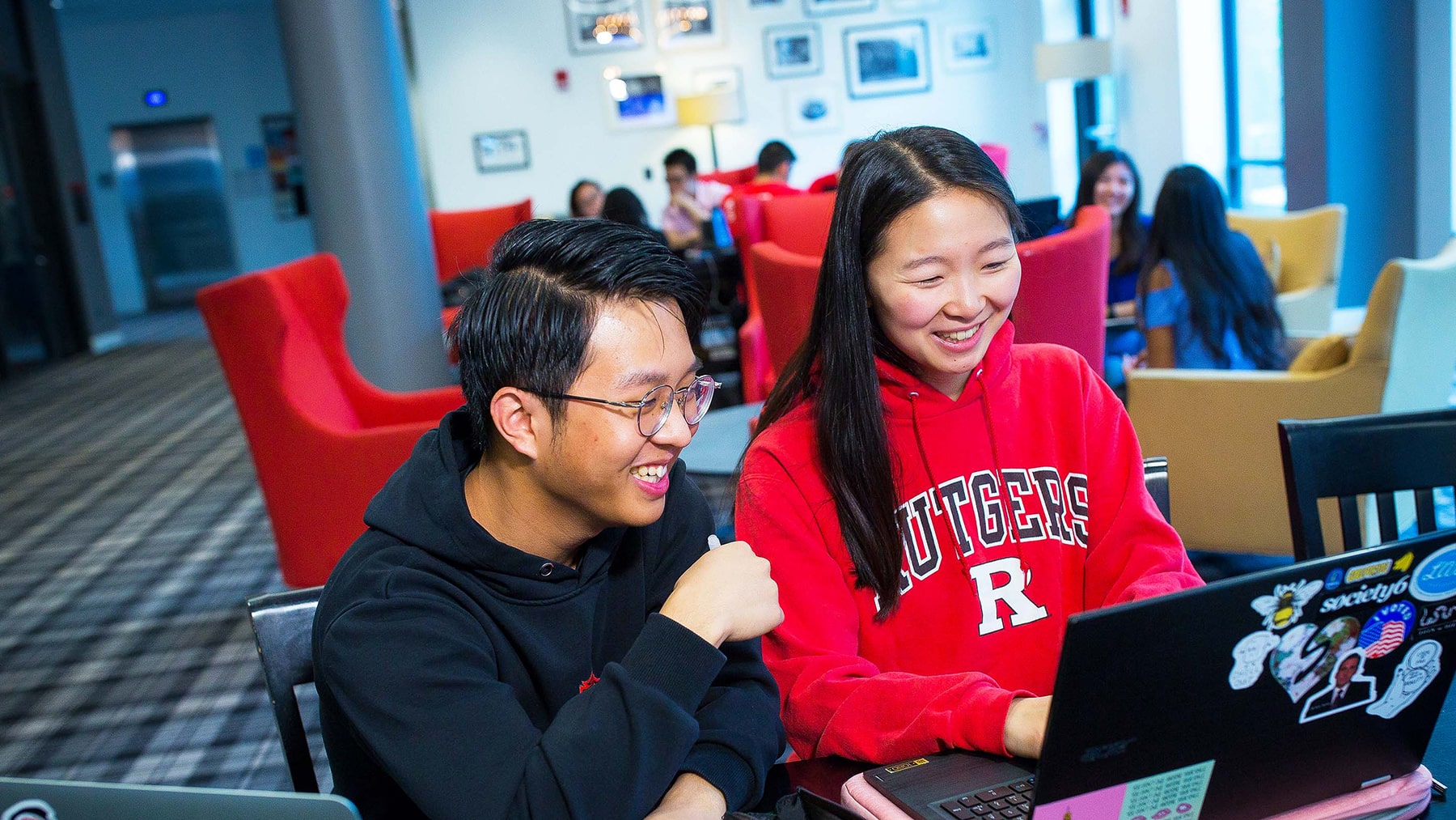 Students sitting a computer